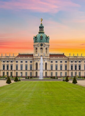 This image shows Charlottenburg Palace, a magnificent baroque palace that offers visitors a glimpse into Berlin's royal past. The beautifully restored rooms and vast gardens provide a serene environment, making it a perfect place for a leisurely stroll. The palace’s grandeur and historical significance transport visitors back in time, offering an escape from the modern city while immersing them in the elegance of Berlin’s royal heritage.