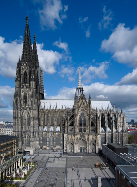 This image shows the awe-inspiring Cologne Cathedral, a masterpiece of Gothic architecture. The cathedral’s towering spires, intricate carvings, and beautiful stained-glass windows make it one of the most impressive structures in Europe. Visitors can climb to the top for an incredible panoramic view of Cologne or explore its sacred interior. The cathedral stands as a testament to both spiritual devotion and architectural brilliance, drawing visitors from all over the world to experience its grandeur.