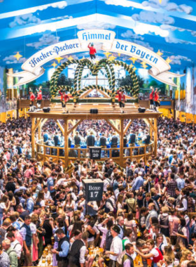 This image shows the lively and colorful Oktoberfest in Munich, the world’s largest beer festival. The festival is a vibrant celebration of Bavarian culture, featuring traditional beer tents, hearty food, and plenty of fun. People from all over the world come together to enjoy the festivities, with music, dancing, and, of course, delicious Bavarian beer. It’s the perfect occasion to immerse yourself in the lively spirit of Germany and experience authentic Bavarian hospitality at its finest.