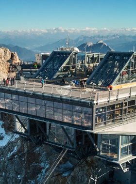 This image shows the breathtaking view from Zugspitze, Germany’s highest mountain, towering above the Bavarian Alps. Whether you enjoy skiing in the winter or hiking in the summer, Zugspitze offers year-round outdoor adventure. The panoramic views from the observation deck are stunning, providing a bird’s-eye view of the surrounding mountains and valleys. Zugspitze is a must-visit for nature lovers and adventure seekers looking to experience the beauty of the Alps up close.