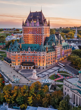 This image shows the charming streets of Old Quebec City, lined with cobblestone roads, historic buildings, and European-style architecture. The area is filled with vibrant shops, cozy cafes, and street performers creating a lively atmosphere. Visitors can explore famous landmarks like Château Frontenac, one of the most photographed hotels in the world. The city transforms in winter with Christmas lights and snow-covered rooftops, making it a magical destination. The blend of history, culture, and French influence makes Old Quebec a must-visit location in Canada.