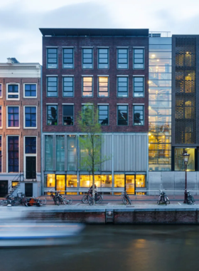 This image shows the exterior of the Anne Frank House in Amsterdam, a deeply historic museum dedicated to the life and story of Anne Frank, a Jewish girl who hid from Nazi persecution during World War II. The museum offers visitors a chance to explore the actual secret annex where Anne and her family lived for over two years. The house is a poignant reminder of the struggles faced during the war and honors Anne’s memory through an emotional and informative experience.