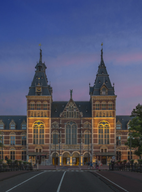 This image shows the impressive entrance of the Rijksmuseum in Amsterdam, one of the most famous museums in the world. The museum is home to a vast collection of art and historical artifacts, including masterpieces by Rembrandt and Vermeer. Visitors can explore the stunning galleries and admire world-renowned works of art, as well as learn about Dutch history and culture. The museum is housed in a grand, ornate building that is as much a work of art as the pieces it holds.