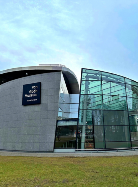 This image shows the exterior of the Van Gogh Museum in Amsterdam, home to the world’s largest collection of works by the famous Dutch artist Vincent van Gogh. The museum allows visitors to explore the life and art of Van Gogh, showcasing his paintings, sketches, and personal letters. This iconic museum is a must-see for art lovers, offering a unique insight into the artist’s creative journey and the emotional depth of his works.