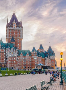 This image shows the beautiful Dufferin Boardwalk in Quebec City, offering a scenic view of the river and the historic Château Frontenac. The boardwalk is a peaceful place to take a stroll, relax on the benches, and enjoy the outdoor atmosphere while overlooking the picturesque surroundings. It’s a perfect spot for visitors to capture the beauty of the city and experience Quebec's serene charm.