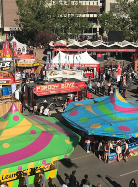 This image shows the festive Calgary Stampede Parade, where participants dressed in traditional western attire march through the streets, celebrating Calgary’s rich cowboy heritage. The parade kicks off the Calgary Stampede, featuring floats, bands, and performers that create a lively atmosphere throughout downtown. It’s a fantastic experience for families, friends, and visitors alike, showcasing the city’s western traditions and community spirit in an exciting and colorful event that brings together people from all walks of life.