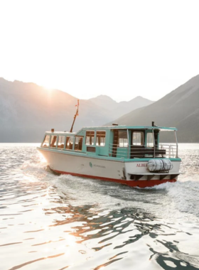 This image shows a boat tour on Lake Minnewanka, a stunning glacial lake in Banff National Park. The tour takes visitors around the crystal-clear waters, offering unparalleled views of the surrounding mountains and glaciers. The boat ride provides a relaxing way to explore this breathtaking lake, and guests can learn about the area's history and natural beauty from the knowledgeable guides. This image shows that Lake Minnewanka is a fantastic spot for a scenic boat tour and a peaceful experience in nature.