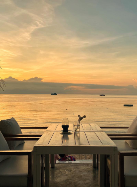 This image shows Whitening Sairee, a stylish beachside restaurant offering fresh seafood and Mediterranean-inspired dishes. The stunning ocean views and sunset setting create the perfect atmosphere for a romantic dinner.