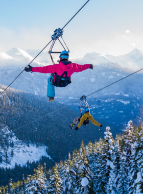 This image shows a person ziplining high above the lush Whistler forests, suspended by a harness and gliding at thrilling speeds. The tall evergreen trees and mountainous backdrop create an exhilarating view. The excitement on the zipliner’s face shows the adrenaline rush of soaring through the air. This image perfectly captures the thrill and beauty of Whistler’s ziplining adventure, offering a unique and unforgettable way to experience the region’s stunning landscapes.