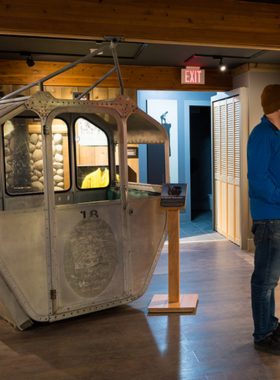 This image shows the interior of the Whistler Museum, with fascinating exhibits showcasing the town’s history, Indigenous culture, and 2010 Winter Olympics memorabilia. Visitors explore interactive displays and read historical information. The well-lit museum space highlights artifacts, photos, and stories from Whistler’s past. This image captures the educational and cultural experience of visiting the Whistler Museum.