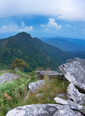 This image shows hikers exploring the trails of Ramkhamhaeng National Park, surrounded by lush forests, waterfalls, and diverse wildlife, making it an excellent spot for nature lovers and adventure seekers.