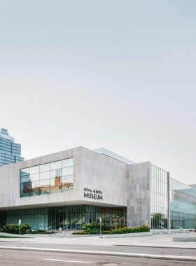 This image shows the exterior of the Royal Alberta Museum in Edmonton, a place filled with fascinating exhibits. Inside, visitors can explore Alberta's rich history, from dinosaur fossils to Indigenous culture and natural wonders. The museum offers an engaging experience for all ages with informative displays and interactive learning opportunities. It’s a must-see spot for anyone interested in learning more about the natural and cultural history of the province."