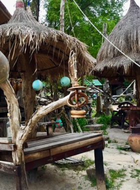 This image shows the nature-themed Jungle Bar, surrounded by tropical greenery and peaceful vibes. Guests enjoy drinks and conversations in a setting that feels like a hidden retreat in the jungle.