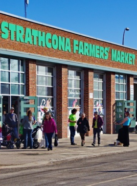 This image shows the bustling Old Strathcona Farmers' Market in Edmonton, where local vendors offer fresh produce, handmade goods, and delicious food items. The market is a vibrant hub for Edmonton’s food and artisan community, with a range of products from local farmers, bakers, and crafters. It’s a great place to find unique items and experience the local culture, making it a favorite spot for shoppers and food lovers alike