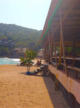 This image shows the clear turquoise waters of Ao Leuk Bay, where vibrant marine life like parrotfish and angelfish can be spotted. The beach’s white sands and calm, shallow waters make it a perfect spot for snorkeling and underwater photography. Visitors can capture stunning marine biodiversity and tranquil landscape shots in this serene location.