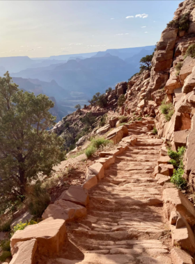 This image shows the challenging South Kaibab Trail, offering hikers a chance to experience the Grand Canyon from a unique perspective. The trail takes you down into the canyon, with steep inclines and stunning views of the canyon walls and Colorado River. The rugged terrain and breathtaking scenery make this hike a memorable adventure for those who love outdoor challenges and wish to witness the Grand Canyon’s beauty up close and personal.