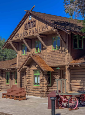 This image shows the historic Grand Canyon Railway Station, a charming landmark in the Grand Canyon Village. The station, built in the early 20th century, serves as the starting point for the Grand Canyon Railway, which brings visitors to the canyon. Its rustic architecture and scenic surroundings make it an important historical site. Visitors can explore the station, enjoy the architecture, and even hop aboard the train to experience the beautiful landscapes surrounding the Grand Canyon."