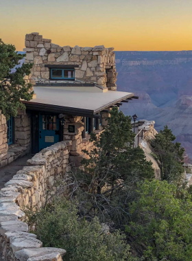 This image shows the Lookout Studio at the Grand Canyon, a historic building designed by architect Mary Colter in 1914. Situated on the edge of the canyon, the studio offers panoramic views of the surrounding landscape and serves as a spot for visitors to enjoy the scenery while learning about the canyon’s history. The studio’s unique design blends seamlessly with the natural surroundings, making it both a functional space for visitors and an architectural marvel in itself."