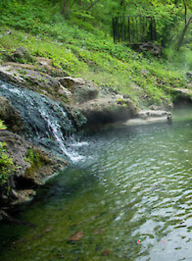 This image shows a scenic drive along the Ouachita Mountains, a beautiful mountainous region surrounding Hot Springs, Arkansas. The winding roads and lush trees provide breathtaking views that can be enjoyed from scenic overlooks. The tranquil drive offers a peaceful escape into nature, perfect for those wanting to experience the stunning landscape of Hot Springs and its surrounding areas. Visitors can stop to capture the natural beauty through photographs or simply enjoy the serene atmosphere.