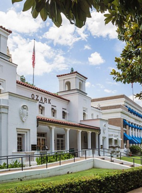 This image shows the historic Bathhouse Row in Hot Springs, Arkansas, where grand bathhouses once served as social hubs. The charming architecture of these buildings now offers a glimpse into the town's past. Visitors can walk through this district to explore the beautifully preserved buildings, some of which have been converted into museums. This image reflects the rich history and architecture of Bathhouse Row, making it a must-visit spot for history enthusiasts and architecture lovers in Hot Springs.