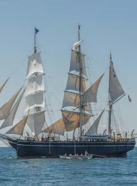 This image shows the Charles W. Morgan, the last surviving wooden whaling ship, docked at Mystic Seaport Museum. Visitors can walk through the ship's decks, exploring the small quarters and imagining the adventures of 19th-century sailors. The ship offers a unique opportunity to connect with maritime history and the brave men who once sailed for months on end. It’s a must-see for history buffs and maritime enthusiasts.