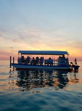 This image shows a relaxing sunset cruise on the Mystic River. As the sun sets, the sky transforms into shades of orange and pink, offering a serene and picturesque view. Whether you're on a romantic getaway or just soaking in the beauty of the town from the water, this cruise provides a perfect way to unwind and enjoy Mystic’s natural beauty. It’s an unforgettable experience that captures the peaceful charm of the river at sunset.