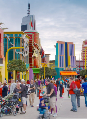 This image shows the exciting Universal Studios Florida theme park in Orlando, offering visitors thrilling rides, movie-themed attractions, and immersive experiences like Diagon Alley from the Harry Potter series. The park’s high-energy roller coasters and interactive shows captivate all ages. Visitors can immerse themselves in blockbuster movie sets, meet favorite characters, and enjoy an action-packed day filled with adventure and fun for the whole family.