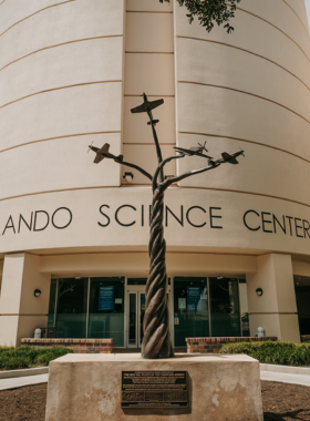 This image shows the Orlando Science Center, a fun and interactive museum that offers hands-on exhibits, a planetarium, and educational displays on topics ranging from dinosaurs to outer space. It’s an excellent destination for families, offering engaging experiences for both children and adults. Visitors can explore scientific concepts through interactive activities, making it an entertaining and educational stop for anyone curious about the world around them.