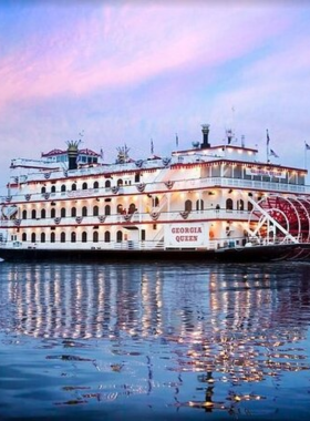 This image shows a Savannah Riverboat Cruise sailing along the Savannah River, offering breathtaking views of the city’s waterfront. The boat is full of tourists enjoying the relaxing tour. The scenic backdrop features historical buildings, lush green landscapes, and the beautiful waterway. Whether on a daytime sightseeing tour or a dinner cruise, the serene views and peaceful experience make this a must-do activity in Savannah.