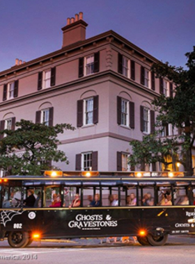 This image shows a group of visitors on a nighttime Savannah Ghost Tour, walking through one of the city's haunted locations. The eerie glow of lanterns lights the path as the guide shares spooky stories and historical tales of the city's haunted past. Savannah’s reputation for being one of the most haunted cities in America is captured in this mysterious and thrilling tour, which takes guests to some of the most notorious haunted spots in the city.