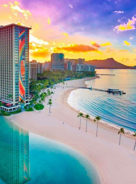 This image shows that Waikiki Beach is one of the most famous beaches in the world. Located in Honolulu, Hawaii, it’s known for its vibrant beach life, crystal-clear waters, and activities like surfing and sunbathing. With a stunning backdrop of the iconic Diamond Head crater, it’s a perfect destination for relaxation and adventure. Visitors enjoy the lively atmosphere, with restaurants, shops, and live entertainment nearby.