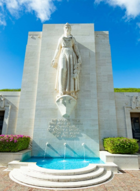 This image shows that Punchbowl Crater, an extinct volcanic crater, is home to the National Memorial Cemetery of the Pacific. This serene and beautiful site honors U.S. military personnel who served during World War II and other conflicts. Visitors can pay their respects while enjoying sweeping views of Honolulu. The peaceful atmosphere and the breathtaking views make this an important historical site for reflection and remembrance.