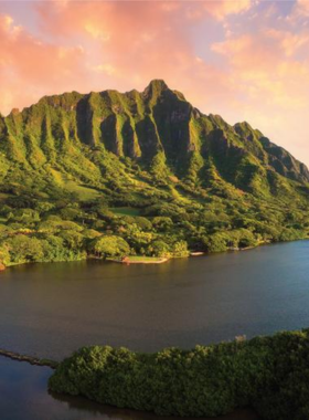 This image shows that Kualoa Ranch is a historic 4,000-acre working cattle ranch in Oahu, famous for its lush landscapes and as the filming location for movies like Jurassic Park. Visitors can explore the ranch through guided tours, including ATV rides, horseback riding, and scenic boat trips. The ranch also offers insight into its historical and cultural significance, making it a unique experience for adventure seekers and history buffs alike.