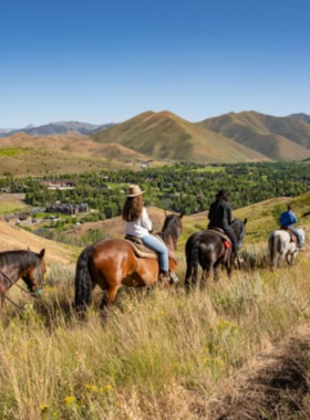 This image shows that horseback riding at Sun Valley Stables is a fantastic way to explore the region’s stunning landscapes on horseback. The image captures a group of riders navigating the scenic trails with views of the surrounding mountains and valleys. Whether you’re a beginner or experienced rider, Sun Valley Stables offers guided rides that showcase the breathtaking beauty of the area, providing a peaceful and adventurous experience for riders of all levels in this idyllic mountain setting.