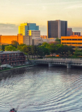 This image shows a scenic boat cruise on the Arkansas River in Wichita, Kansas. Offering beautiful views of the city skyline, bridges, and the Keeper of the Plains statue, the cruise is a relaxing way to explore the area. Visitors can enjoy a peaceful ride along the river, learning about Wichita's history and landmarks. It's a perfect way to unwind and take in the sights of the city from a different perspective.