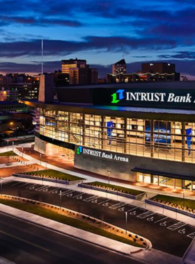 This image shows Intrust Bank Arena in Wichita, Kansas, a modern entertainment venue that hosts concerts, sporting events, and live performances. Known for its great acoustics and seating, the arena provides a high-energy atmosphere for events such as basketball games, hockey, and top-tier concerts. Visitors can enjoy a night out with family or friends, experiencing world-class performances in this state-of-the-art facility.