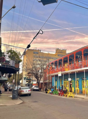 This image shows people enjoying live jazz music on Frenchmen Street in New Orleans. The street is home to some of the best jazz clubs in the city, where musicians play soulful tunes in intimate venues. The vibrant atmosphere, with people dancing and singing along, captures the essence of New Orleans’ rich musical heritage, particularly the jazz that originated here.