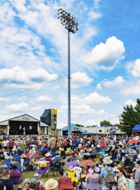 This image shows a lively festival in New Orleans, with people enjoying food, music, and entertainment. The city is famous for hosting a variety of festivals, from the Essence Festival to the New Orleans Film Festival, celebrating its diverse culture, food, and arts. Visitors can immerse themselves in local traditions and enjoy the vibrant atmosphere of these events throughout the year.