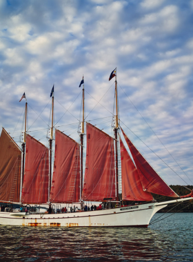 This image shows a scenic boat tour around Bar Harbor, offering views of the harbor and its surroundings from the water. Visitors can explore on a sailing boat, join a lobster fishing trip, or even take a puffin-watching tour. The image captures the tranquility of the water and the beauty of Bar Harbor’s coastline, making the boat tour an unforgettable way to experience the area from a different perspective.