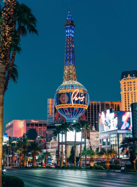 This image shows that the Las Vegas Strip is full of life, with bright neon lights, busy casinos, street performers, and large-scale hotels. Visitors from all over the world walk through the Strip, taking in the sights and sounds of this lively location. The Strip is a hub of activity 24/7, offering a blend of entertainment, shopping, and dining. It is an iconic part of Las Vegas, representing the city’s vibrant nightlife and entertainment culture, where tourists can explore from one hotel to another. Whether day or night, the energy never stops, making it a must-visit for anyone in Las Vegas.