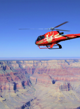 This image shows that a Grand Canyon helicopter tour provides an unforgettable view of one of the world’s most famous natural wonders. As you soar over the canyon’s vast landscape, you can marvel at the stunning rock formations and deep canyons carved over millions of years. Helicopter tours offer a unique perspective of the canyon, allowing visitors to see parts that are otherwise inaccessible. Some tours even include landing in the canyon for a closer look, making it a thrilling and awe-inspiring adventure for tourists looking for an exceptional experience.