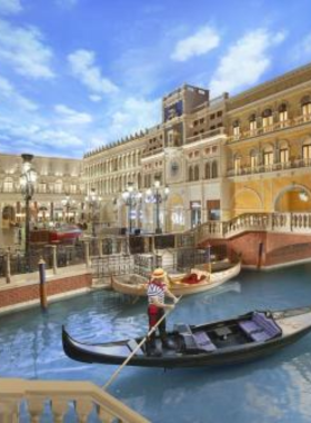 This image shows that the Venetian Hotel in Las Vegas offers a romantic gondola ride through canals inspired by Venice, Italy. Visitors can enjoy a peaceful journey along the waterways while gondoliers serenade them with Italian songs. The indoor and outdoor canals provide a picturesque setting, with the stunning architecture of The Venetian surrounding them. The gondola ride is a favorite for couples looking to experience a moment of relaxation away from the hustle and bustle of the Strip, making it a must-try attraction in Las Vegas.