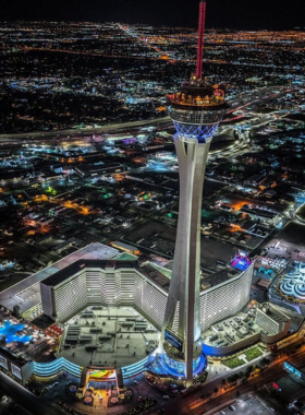 This image shows that The STRAT, formerly known as the Stratosphere, is home to some of the most thrilling rides in Las Vegas, located at the top of the city’s tallest building. Visitors can experience adrenaline-pumping attractions like Insanity, which dangles riders over the edge of the tower, and X-Scream, which sends them over the side of the tower. These rides offer breathtaking views of the city and are perfect for thrill-seekers. The STRAT is an iconic part of Las Vegas, providing visitors with both exhilarating rides and stunning panoramic views.