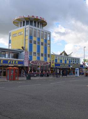 This image shows Clarence Pier, a traditional British seaside amusement park in Southsea, Portsmouth. The pier is packed with fairground rides, arcade games, and food stalls, making it a fun and nostalgic destination for families and visitors. Whether you’re taking a ride, playing games, or enjoying seaside snacks, Clarence Pier offers a quintessential British pier experience with plenty of entertainment. It's a place where you can relax and enjoy the classic atmosphere of a seaside amusement park.