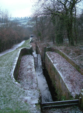 This image shows the scenic Fourteen Locks Canal Centre, a historic canal system surrounded by lush greenery and calm waterways. The well-preserved locks are a reminder of Newport’s industrial past, and visitors can walk along the peaceful towpaths, enjoying the serene countryside. A small café at the visitor center offers tea and snacks, making it a great spot for a relaxing morning stroll.