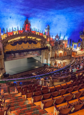 This image shows the stunning interior of the Majestic Theatre, a historic venue in San Antonio. The grand chandeliers, ornate ceilings, and red velvet seats create an elegant atmosphere. The stage is set for a live performance, with an excited audience waiting for the show to begin. Whether it’s a Broadway play, a concert, or a comedy act, the experience is truly magical in this architectural masterpiece.