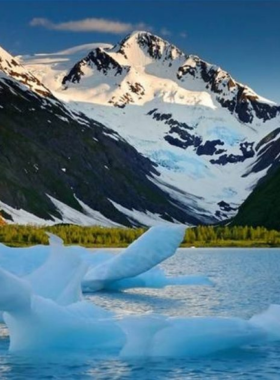 This image shows that Portage Glacier is one of the most iconic natural sights near Anchorage, Alaska. The image captures the breathtaking view of the glacier surrounded by towering mountains, with icebergs floating on the water. Visitors can enjoy scenic boat tours, hike nearby trails, or simply relax and soak in the beauty of the glacier and its surroundings. Portage Glacier is a popular destination for anyone visiting Anchorage, offering opportunities for nature lovers and adventure seekers alike.

