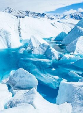 This image shows that Matanuska Glacier is a stunning natural feature in Alaska, offering visitors a chance to explore its icy surface and dramatic landscapes. The glacier stretches for miles and is accessible for guided hikes, ice climbing, and photography. The snow-covered mountains and the glacier's massive ice formations create a beautiful and captivating scene. Matanuska Glacier is one of the best places to experience the awe-inspiring beauty of Alaska's glaciers up close.